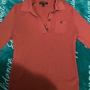 It’s a rust color , long sleeve and super soft